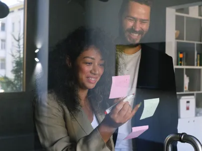 young-woman-working-on-laptop-smiling.png