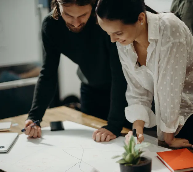 man-and-woman-looking-at-paperwork.png