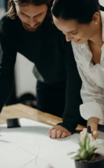 man-and-woman-looking-at-paperwork-1.png